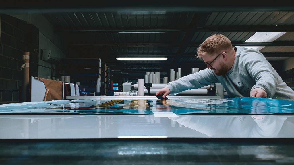 Portfolio - Lee Working on Farmer Palmer's Father Christmas 2019 Print - Insignia Signs