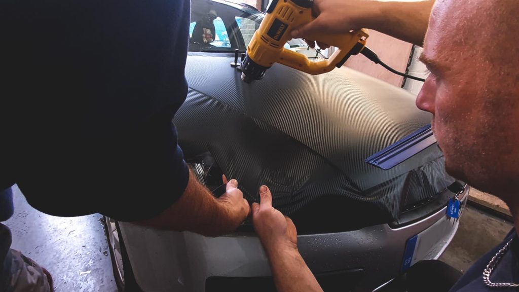 Portfolio - Car Bonnet Carbon Wrap in Progress - Insignia Signs