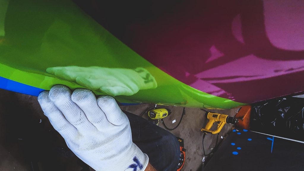 Portfolio - Osmond Ergonomics Close up Detailed Inspection of Van Wrap - Insignia Signs
